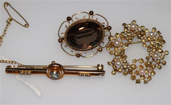 A 15ct gold and gem set bar brooch and two 9ct brooches.